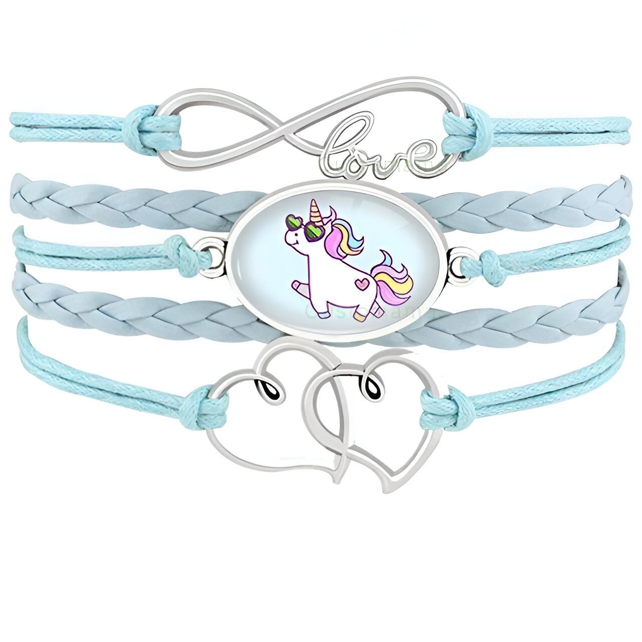 L'image montre un bracelet en cuir bleu avec un pendentif en forme de licorne. La licorne est représentée avec des lunettes de soleil et une crinière arc-en-ciel. Le bracelet est également décoré de deux cœurs en métal.